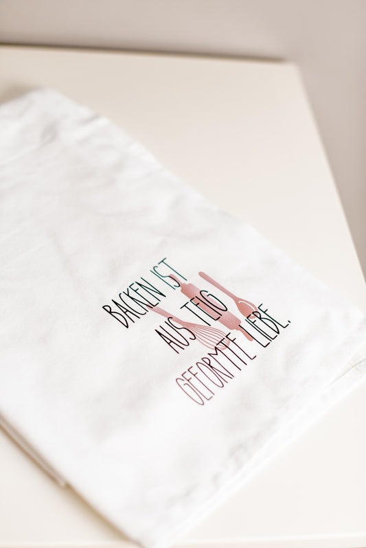 Geschirrtuch mit Spruch 'Backen ist aus Teig geformte Liebe' - Geschenk zum Einzug, Hochzeit oder Muttertag